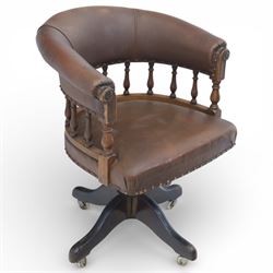 20th century swivel captains desk chair, the brown leather upholstered back and seat with ...