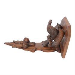 Edwardian oak clock bracket, carved with an eagle support over fruiting foliage, H37cm