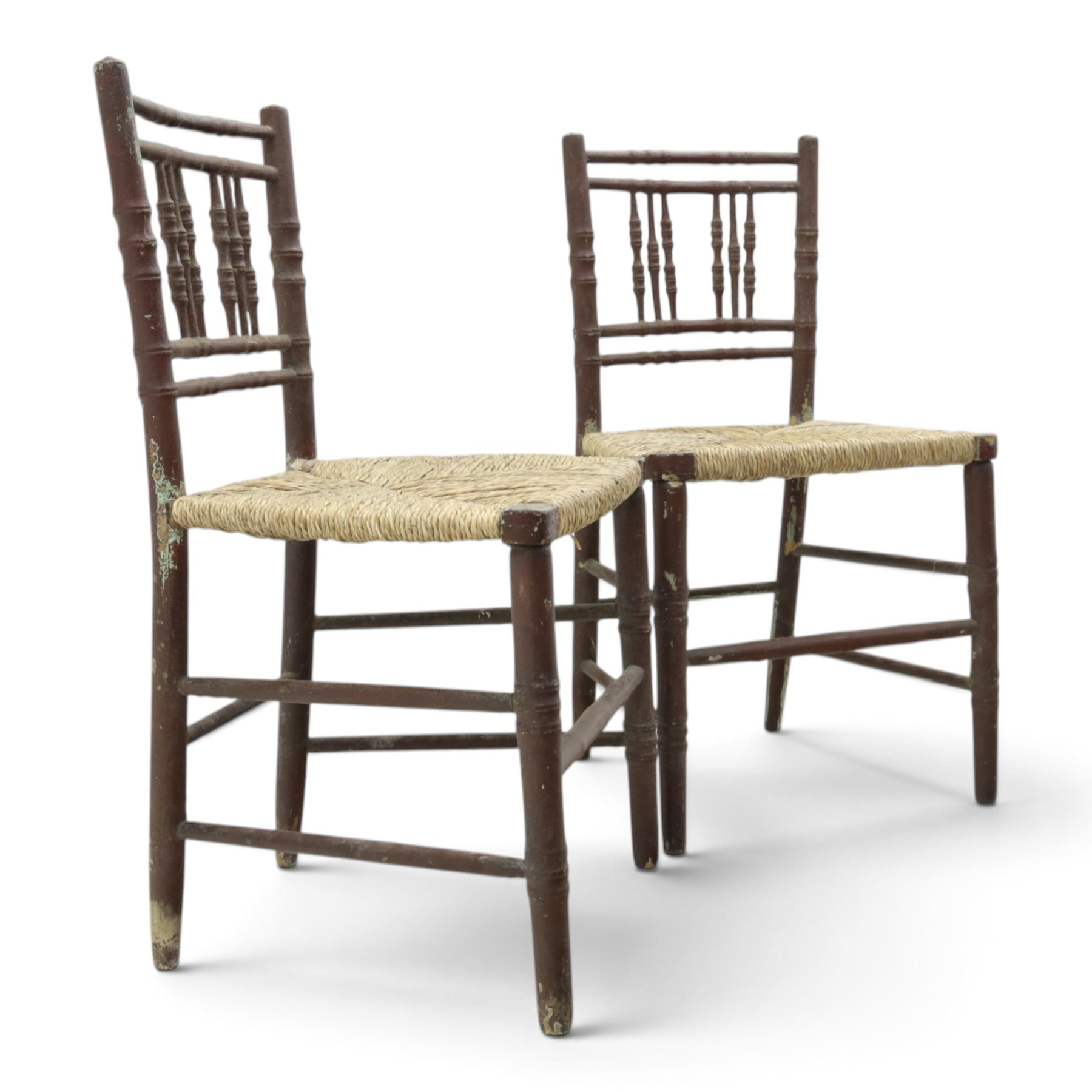 Pair of 19th century lacquered faux bamboo rush seated side chairs chairs, original blue paint under later ox-blood lacquer finish