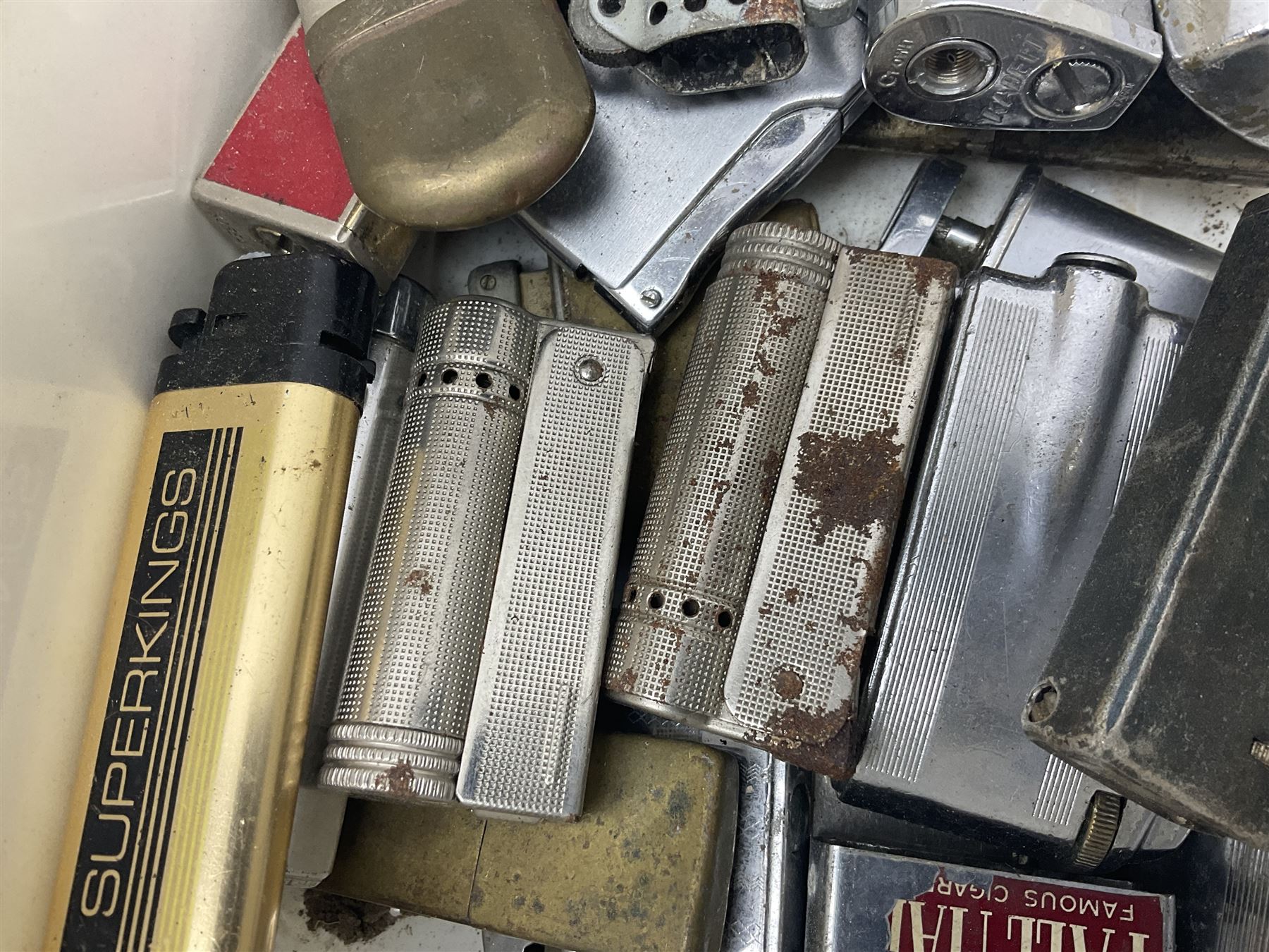 John Smiths presentation box commemorating 100 years of the Tadcaster brewery, containing two bottles of special brew and a glass, and a collection of lighters including Ronson and Jutson