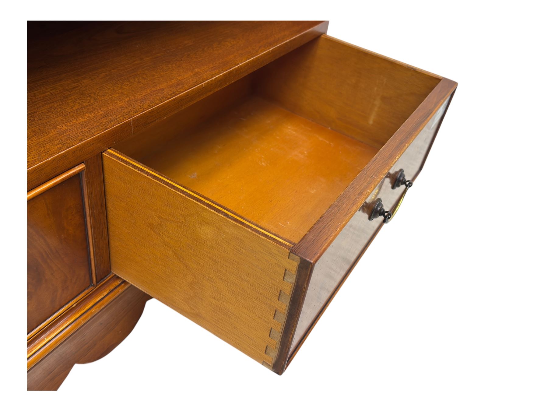 Ian Smith Furniture - Georgian design walnut open bookcase, projecting cornice over pierced geometric frieze, fitted with three adjustable fluted shelves above two drawers, on shaped plinth base 