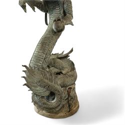 Verdigris hand finished cast brass Chinese Dragon garden centre-piece fountain, scaled dragon with gaping jaw holding an orb, curled tail on wave cast base