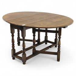 17th century design oak gateleg dining table, oval drop-leaf top on baluster turned supports, twin swinging gate legs united by peripheral stretchers (Extends to 149cm)