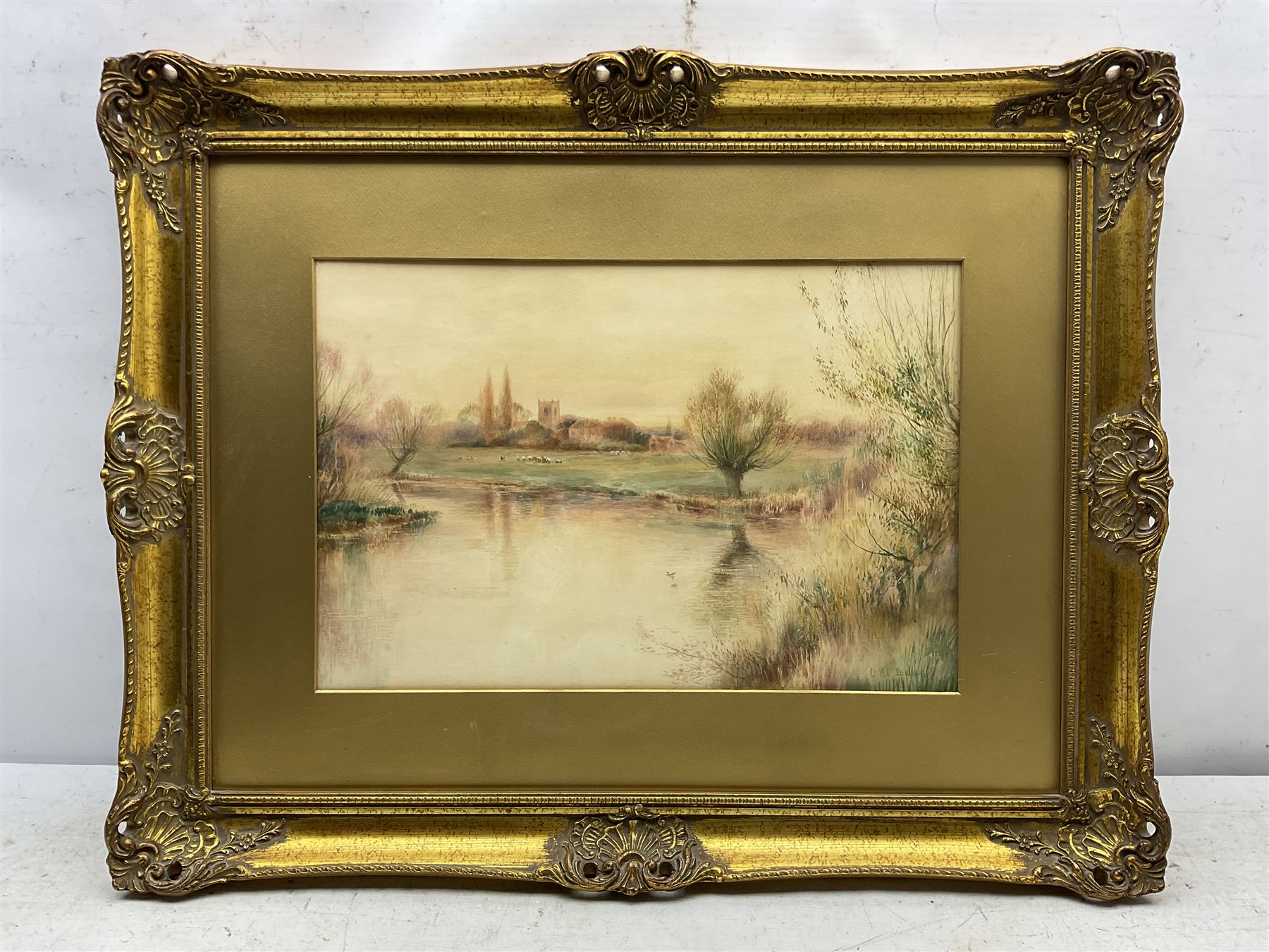 Charles Henry Clifford Baldwyn (British 1859-1943): River Landscape with Church, watercolour signed 30cm x 45cm 
Notes: Baldwyn was a Worcester artist, starting work at the Royal Worcester porcelain factory at the age of 15. He was most famous for his beautiful paintings of swans in flight.