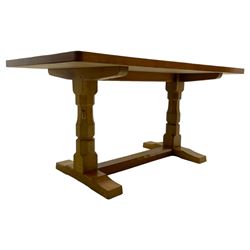 Mouseman - oak dining table, adzed rectangular top on twin octagonal pillar supports, sledge feet united by floor stretcher, by the workshop of Robert Thompson, Kilburn 