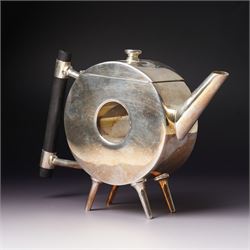 Manner of Christopher Dresser (1834-1904) - two art deco design silver plated teapots, of circular and square form with vacant centre, ebonised handles, each marked and with registration mark, max H18cm (2)