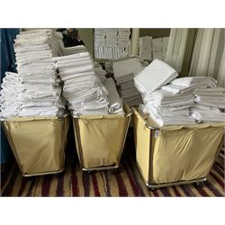 314 white linen King sheets, 138 single duvets covers and other, with three linen trolleys- LOT SUBJECT TO VAT ON THE HAMMER PRICE - To be collected by appointment from The Ambassador Hotel, 36-38 Esplanade, Scarborough YO11 2AY. ALL GOODS MUST BE REMOVED BY WEDNESDAY 15TH JUNE.