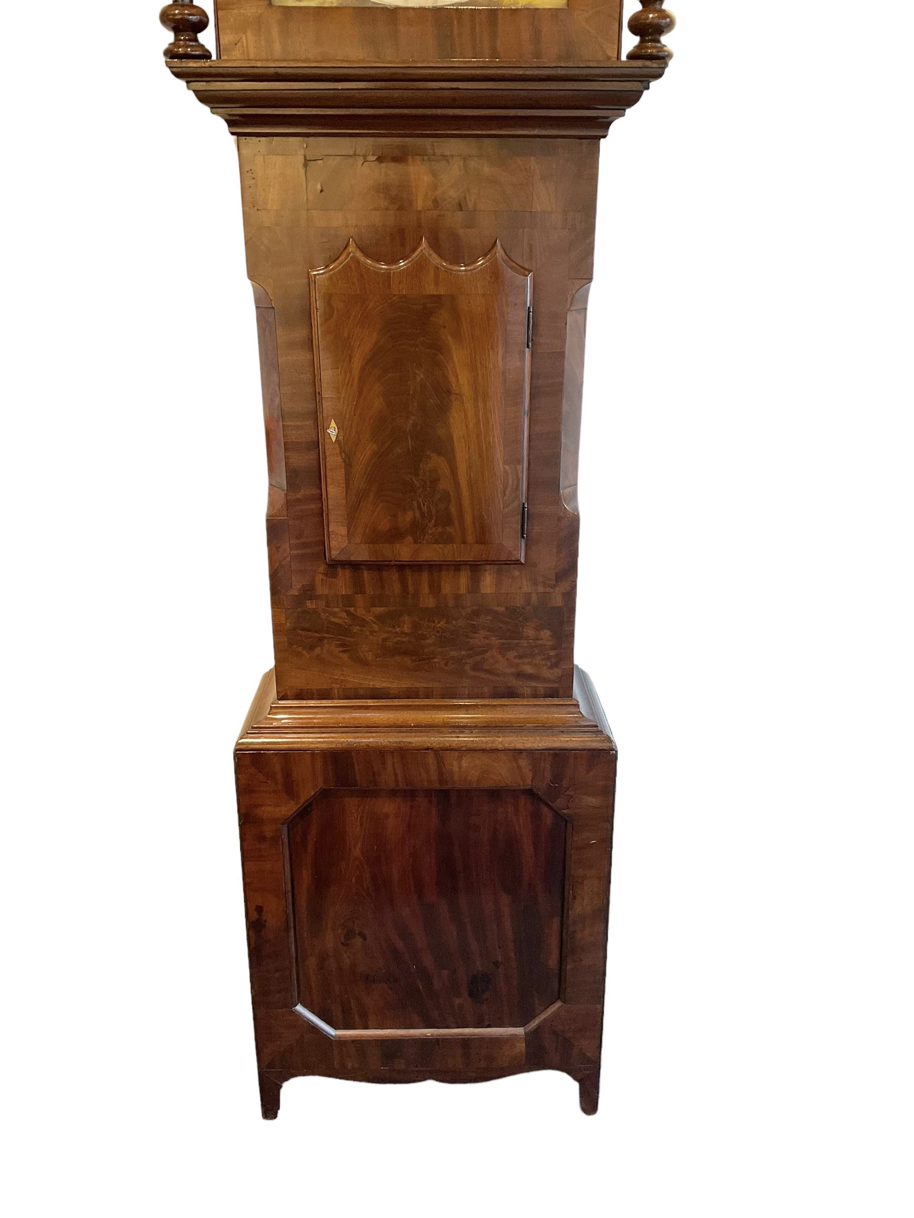 Late 19th century 30 hour Yorkshire mahogany longcase clock, with a swans necked pediment and break arch hood door flanked by two ring turned pilasters, trunk with a short door with a bone escutcheon on a wide plinth with a recessed panel, painted dial with a depiction of a sportsman to the arch and game birds to the spandrels, Roman numerals, minute markers and brass hands, chain driven countwheel striking movement. With weight and pendulum.