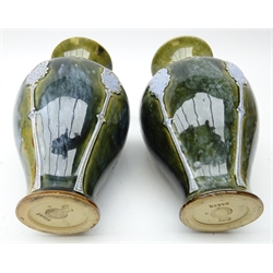  Pair of Royal Doulton stoneware vases, baluster form with flared rim decorated in relief with stylized foliage, impressed 8482B H21cm   