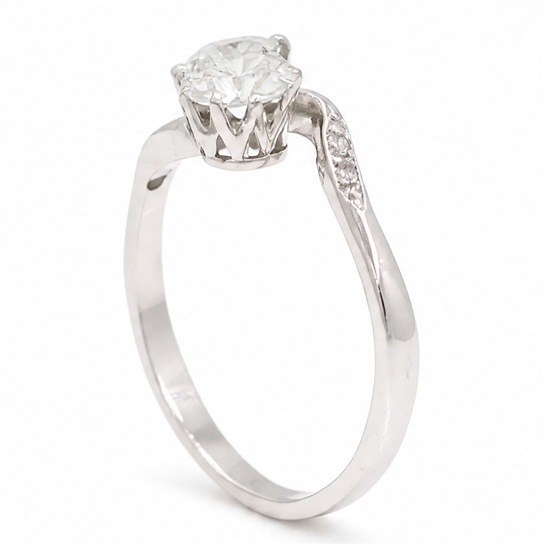 Platinum diamond crossover ring, set with two round brilliant cut diamonds and diamond set shoulders, Birmingham assay mark, total diamond weight approx 1.45 carat