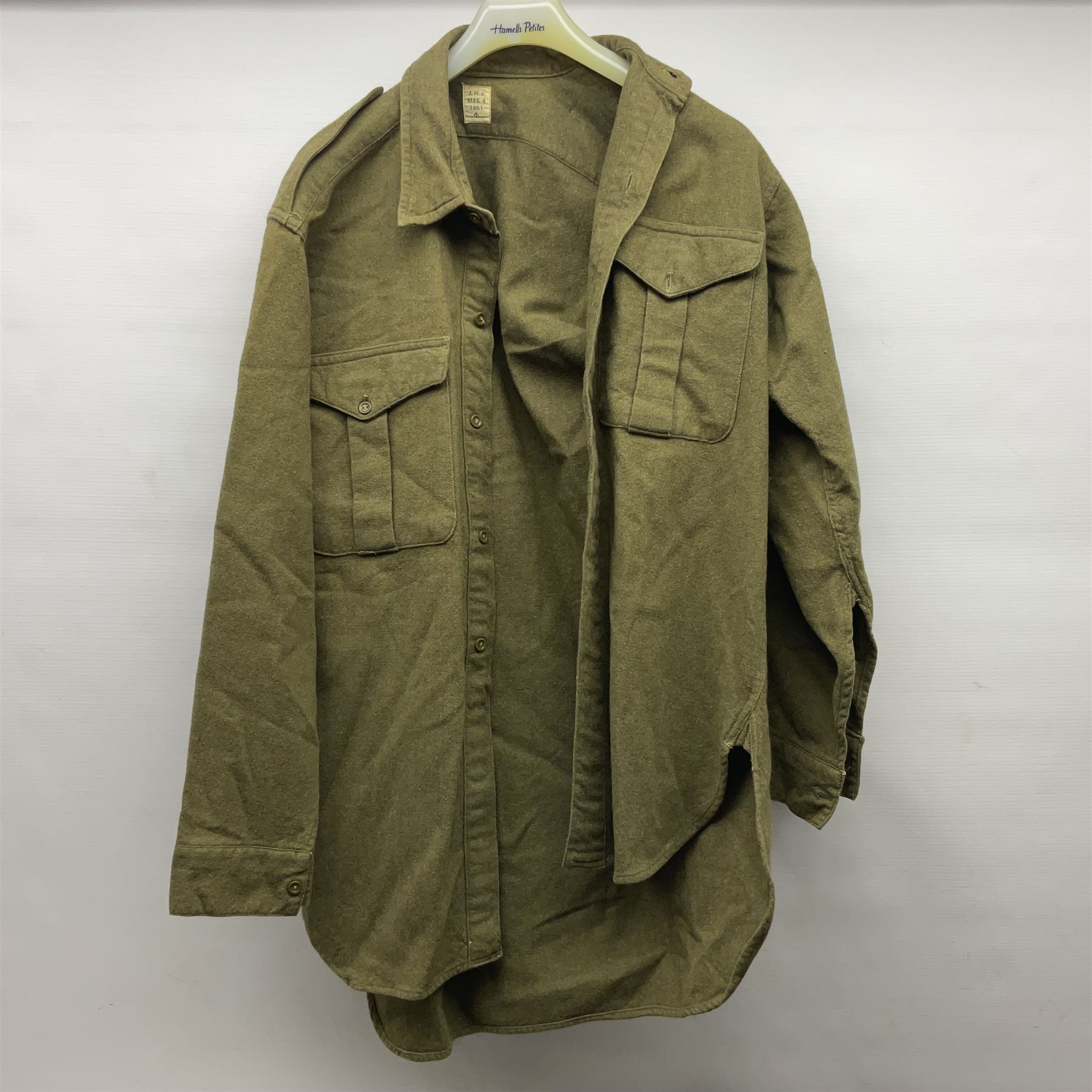Two post-WWII British Army No.2 Dress tunics, one with Green Howards buttons; army shirt dated 1951; Royal Fleet Auxilliary jacket with trousers; three RAF/WAAF uniforms and RAF Greatcoat; and three canvas/webbing bags, two dated 1943 & 1945