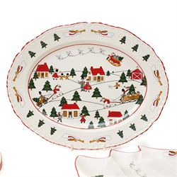 Masons Christmas Village dinner wares, designed by Marsten-Mandrajji, comprising three dinner plates, four lunch plates, tree shaped bon bon dish, serving platter, cake stand, napkin rings etc