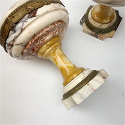 Pair of Neo Classical veined white marble urns, decorated with a metal band of classical drapes, raised upon a pedestal foot, H23cm