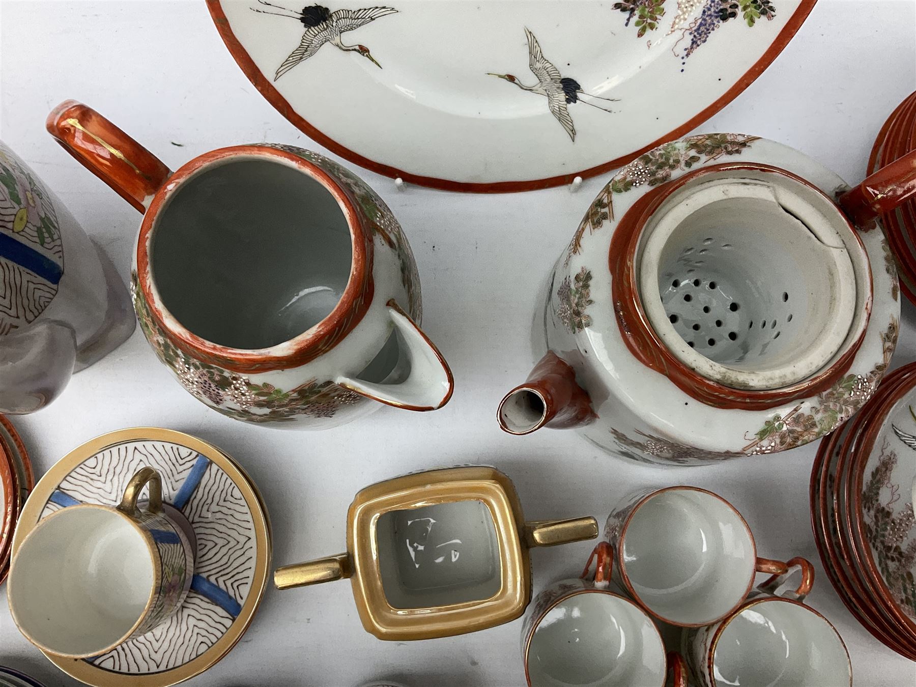  Japanese eggshell tea service, decorated with cranes and wisteria, to include teapot, coffee pot, coffee cans plates etc, together with another coffee set and John Lewis coffee cans  