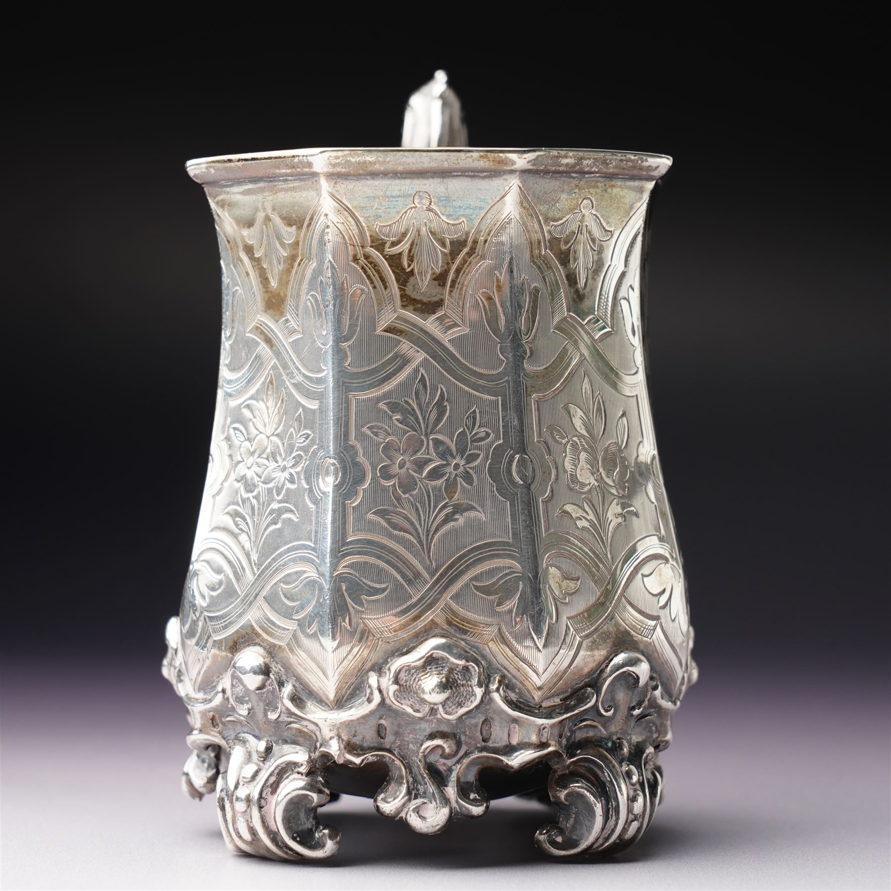 Victorian silver christening mug of panel sided design with gilded interior, engraved decoration and scroll handle and feet H10cm London 1848 Maker Charles Reily & George Storer