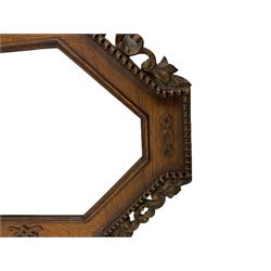 Early 20th century oak framed wall mirror, carved details and beaded surround, bevelled plate