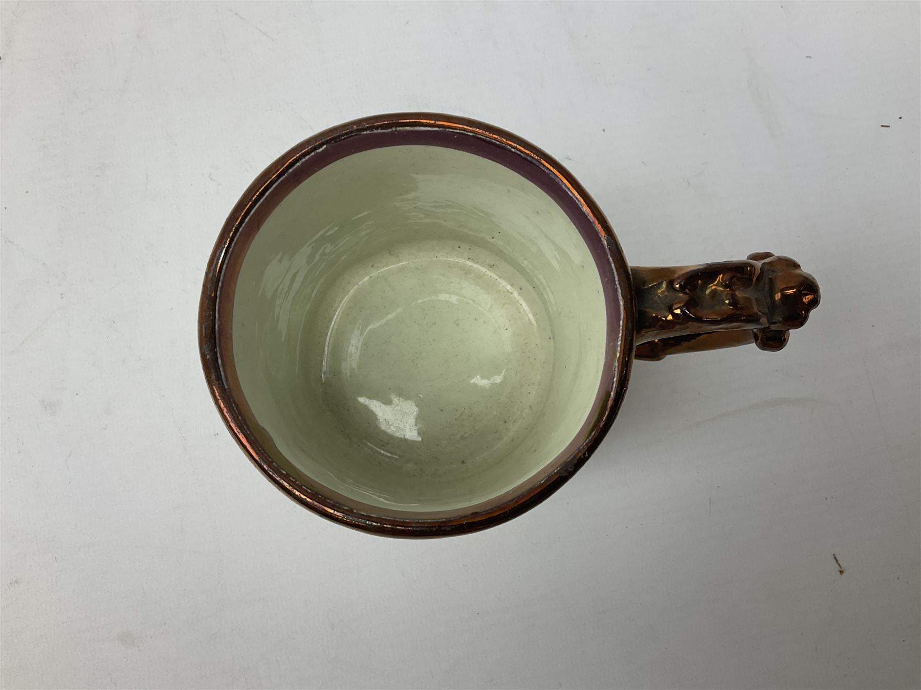 Five 19th century blue and white Delft tiles, each decorated with a central circular panel, containing buildings, boat, and swan, and a Victorian lustre mug decorated with polychrome flowers, tiles H13cm W13cm. 