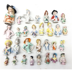  Collection of thirty ceramic pin cushion/ half dolls of varying size H11cm max  