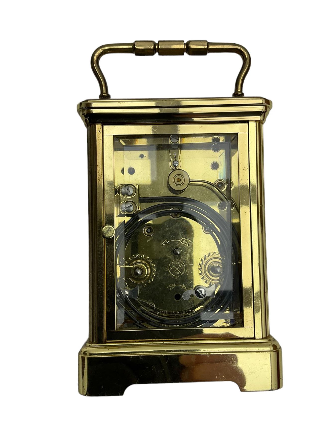 8-day French 20th century corniche carriage clock with a striking movement and repeat work, white enamel dial with Roman numerals, minute track and steel moon hands, dial inscribed St James, London. With a jewelled lever escapement, striking the hours and half hours on a coiled gong. 
