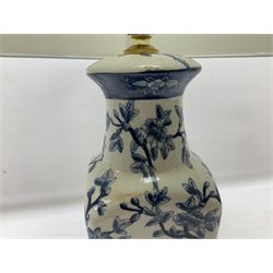 India Jane table lamp, decorated with blue birds and floral vines upon a white ground, fitted with a cream lampshade, H62cm 