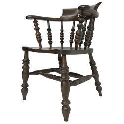 Early 20th century stained beech captains smokers bow chair, spindle tub shaped back over saddle seat, raised on turned supports united by double H-stretcher