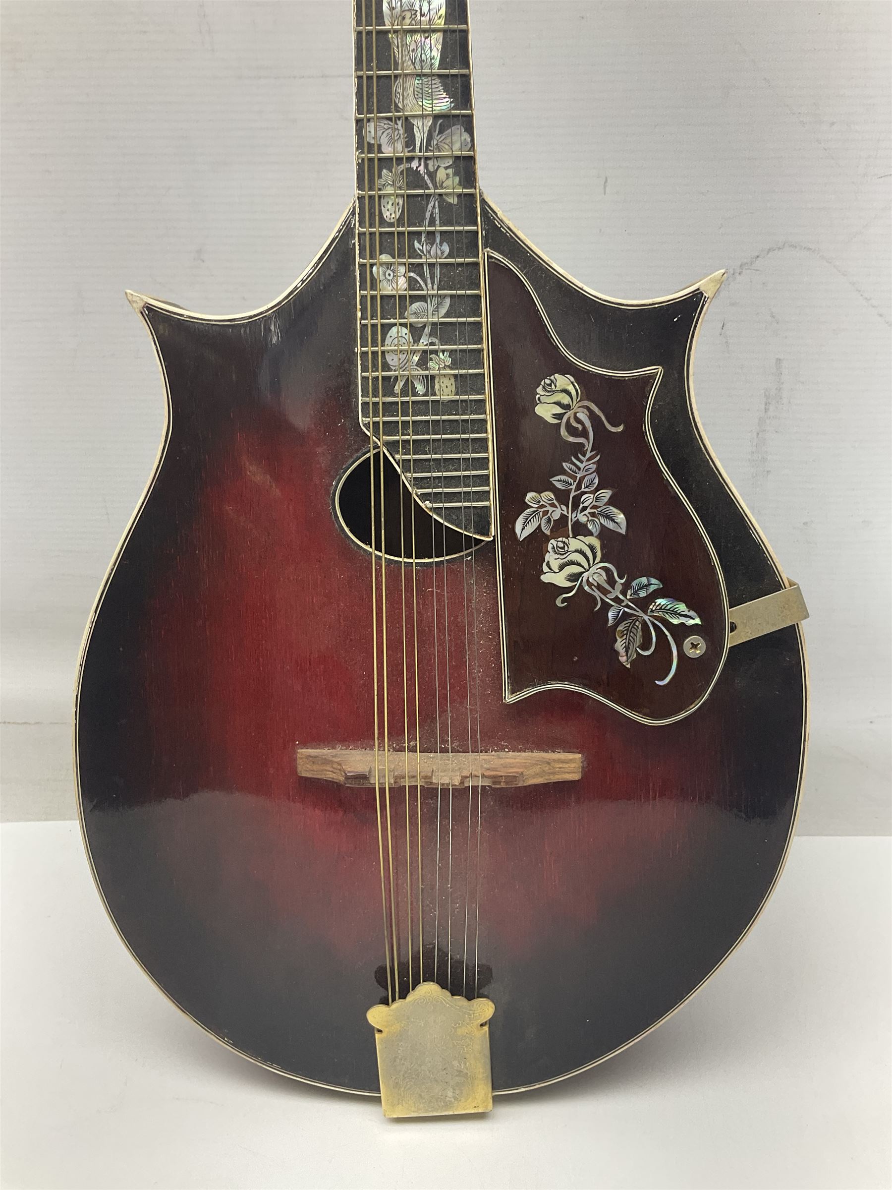 Eastern eight-string mandolin with sunburst finish and mother-of-pearl inlay L68.5cm; and another Harmony mandolin with cracked headstock (2)