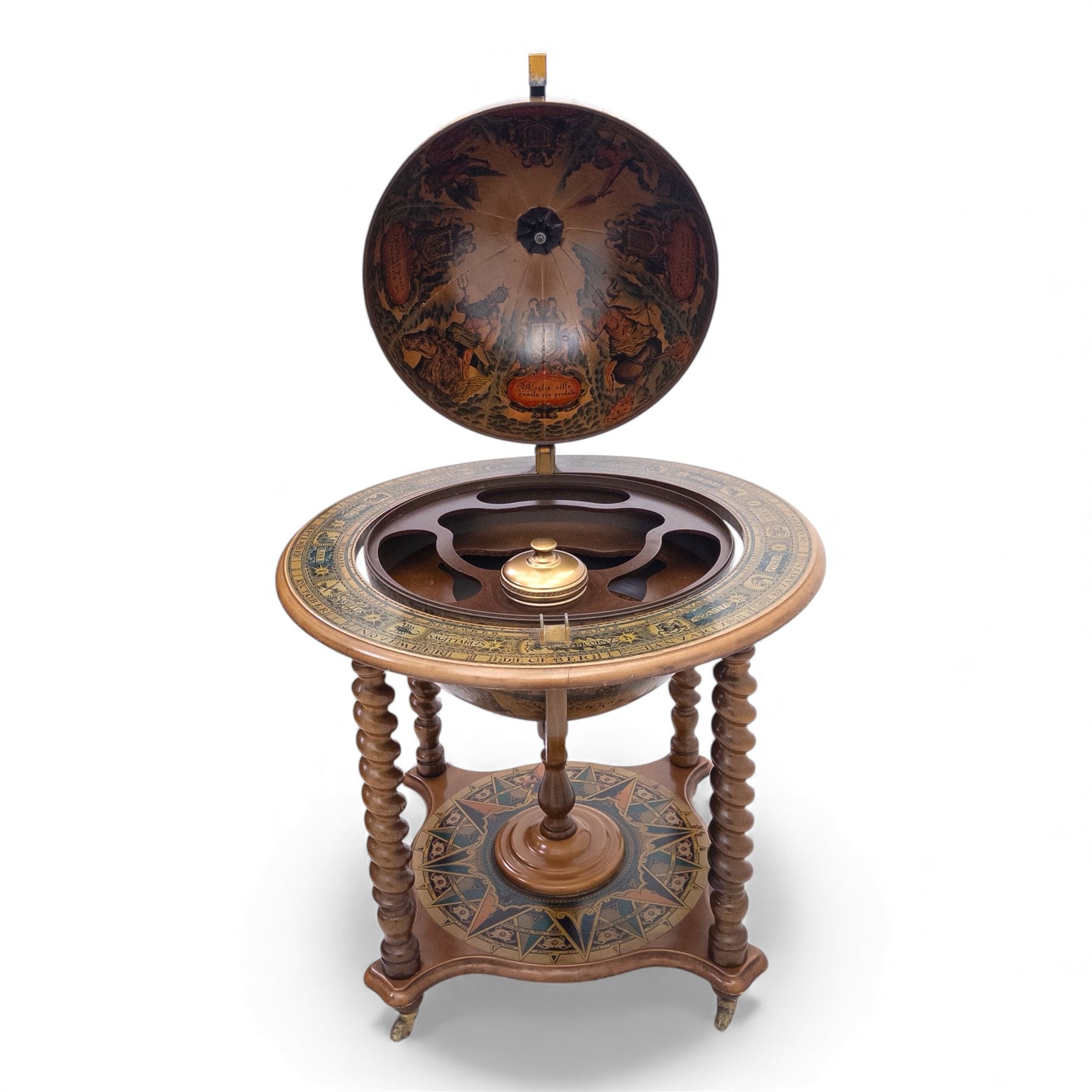 20th century Italian reproduction globe drinks table, the cartographic sphere decorated with Renaissance-style map scenes, hinged upper section enclosing bottle storage, with printed zodiac and calendar ring to the top, on spiral-turned legs joined by a compass rose undertier, brass castors below