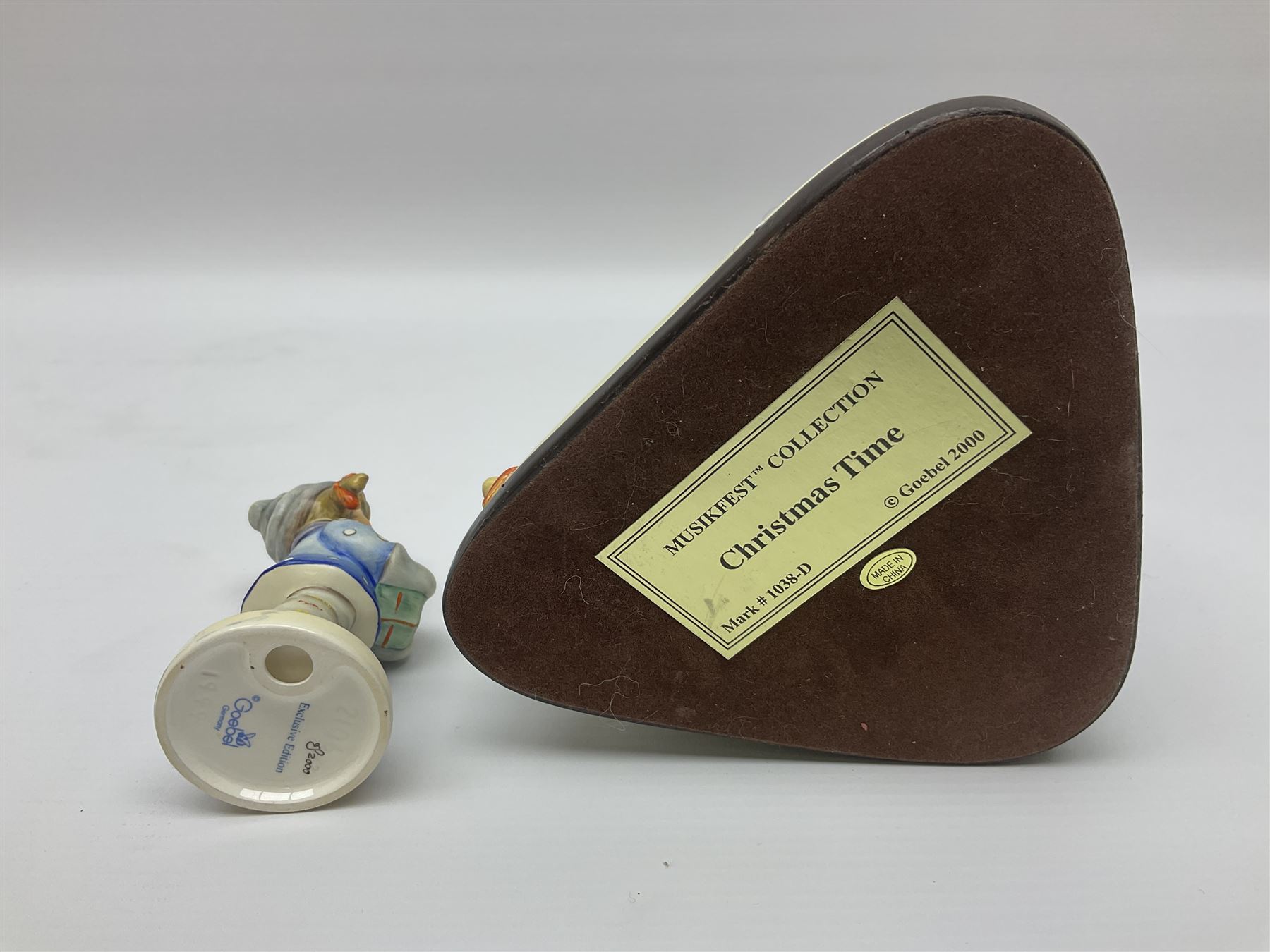 Eight Christmas Hummel figures by Goebel, to include Wintertime Chapel candle holder, Winter Fun, Christmas Morning, Christmas Time and Gingerbread Lane, tallest H21cm