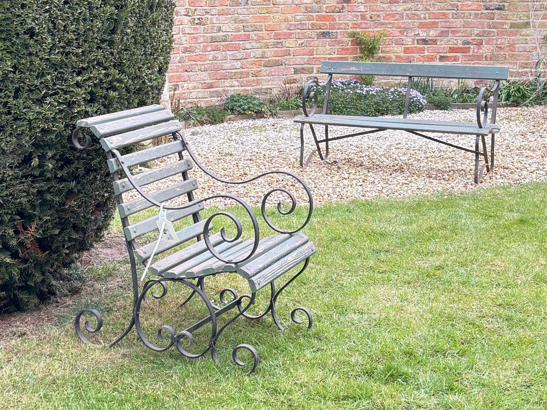 20th century scrolled wrought iron garden bench (L140cm) together with a similar chair (2)  - COLLECTION BY APPOINTMENT FROM: The White House, Thirsk Road, Easingwold, York, YO61 3NF - CALL 01723 507111 TO ARRANGE