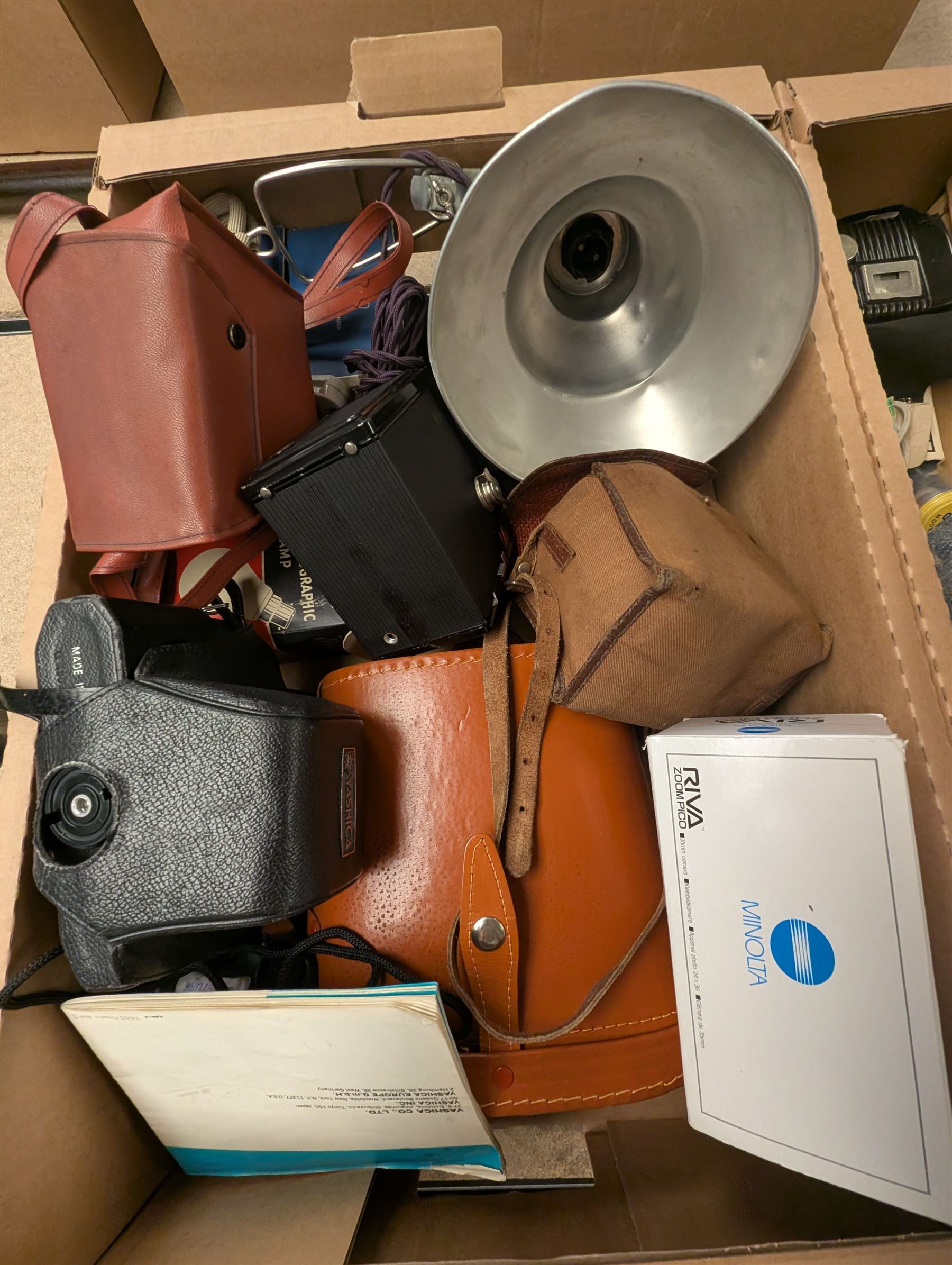 Collection of vintage cameras and photography equipment, including Minolta Riva Pico camera, Ensign Ful-VUe camera, Agfa Synchro Box, Yashica TL-Electro SLR Camera, pair of Ajaz 10x50 binoculars, etc