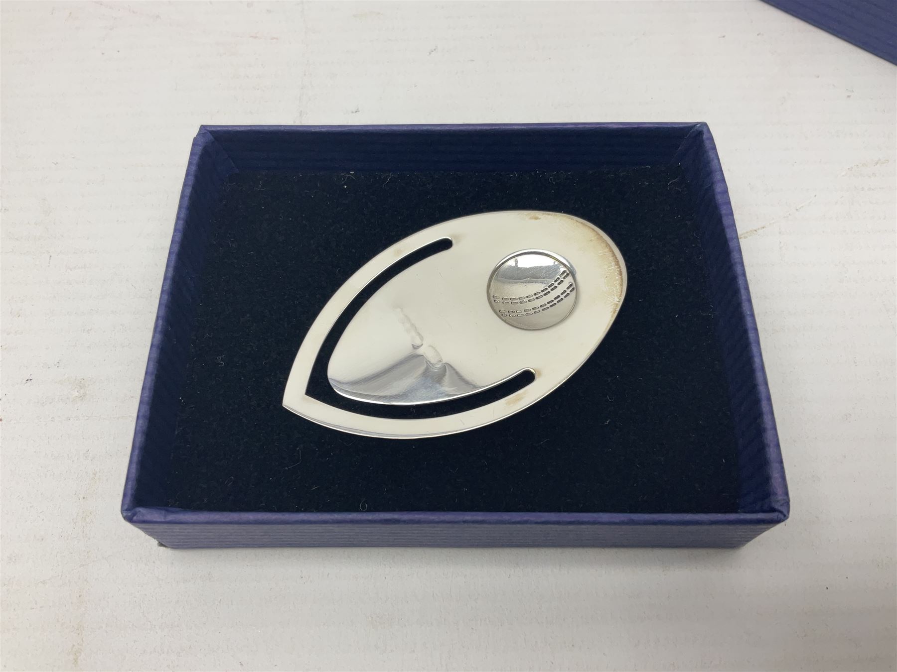 Modern silver bookmark, embossed with cricket ball, hallmarked Laurence R Watson & Co, Birmingham 2003, H6cm, boxed 