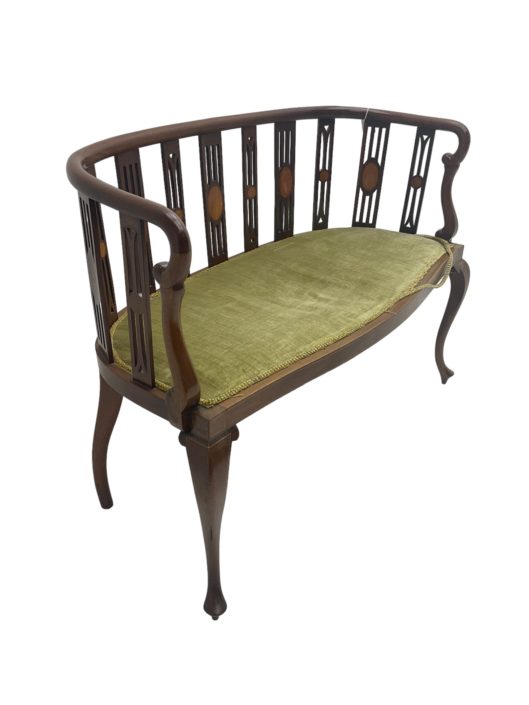Edwardian inlaid mahogany salon settee or bench, the pierced and inlaid splat back over serpentine front, seat upholstered in laurel green velvet, raised on cabriole supports with satinwood stringing