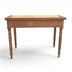 Early 19th century mahogany dressing table, rectangular top with three quarter gallery, frieze drawer with two brass knobs, stamped 'Gillow', raised on turned and reeded supports 