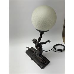 An Art Deco style composite bronze effect table lamp by Crosa, modelled as a semi nude female figure supporting a spherical crackle effect shade in her outstretched hand, overall approximately H47cm.