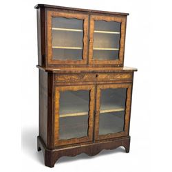 Late 19th century continental display cabinet, the upper section is glazed with twin doors...