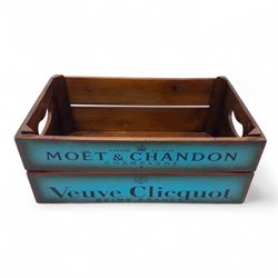 Three-piece champagne advertising display set, comprising pine steps with painted Dom Pérignon and Bollinger lettering, and two wooden boxes branded Moët & Chandon and Veuve Clicquot (Steps H 80cm, W 44cm, D 68cm, crates each H 18cm, W 44cm, D 26cm)