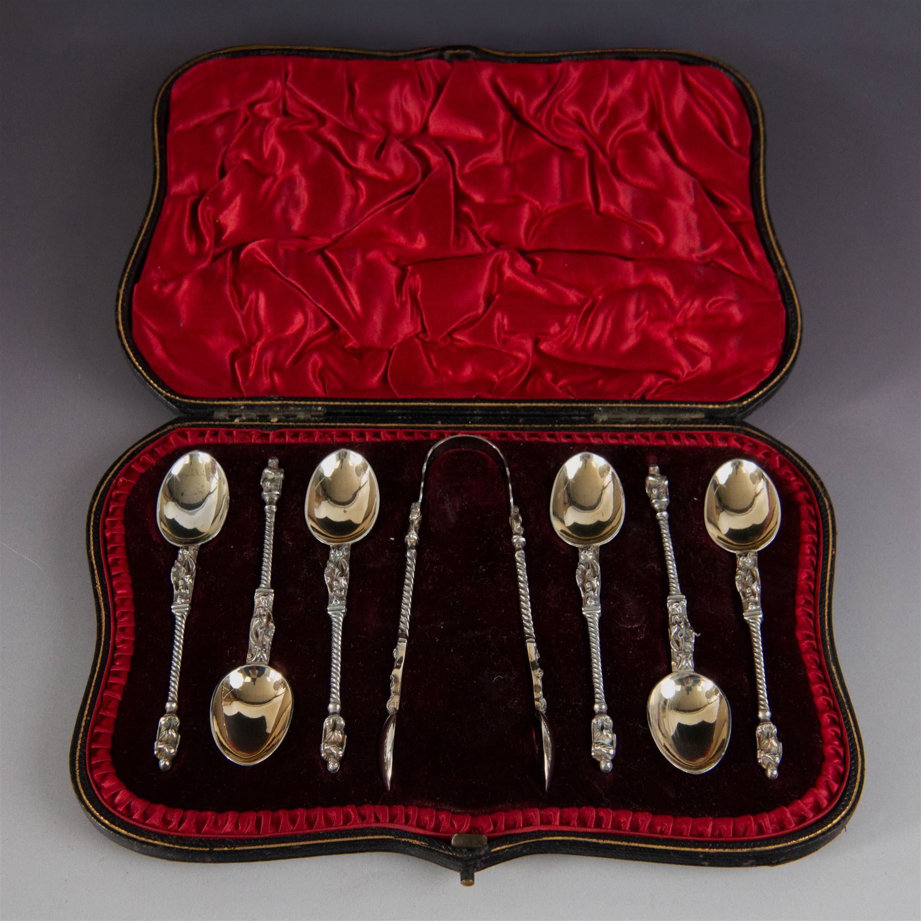 Set of six late Victorian silver apostle spoons and sugar tongs, hallmarked Robert Stebbings, London 1897, in fitted cased with silk and velvet lined interior