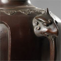 Japanese late Meiji period bronze koro and cover, surmounted by an eagle finial and with bird decoration in high relief to each side, twin elephant trunk handles, bearing indistinct character signature to one side, H82cm
