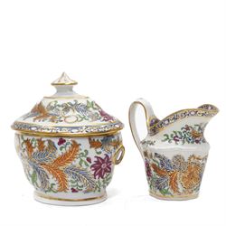 New Hall part tea and coffee service richly decorated  with a Tobacco Leaf design in pattern 274 comprising nine tea cups, eight coffee cans, ten saucers, tea pot and stand, sucrier and cover, slop bowl, milk jug and plate, circa 1800