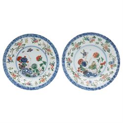 Two Chinese Kangxi period famille verte cafe au lait saucers, decorated with native animals among foliage, with indistinct mark within double rings beneath, D14cm 