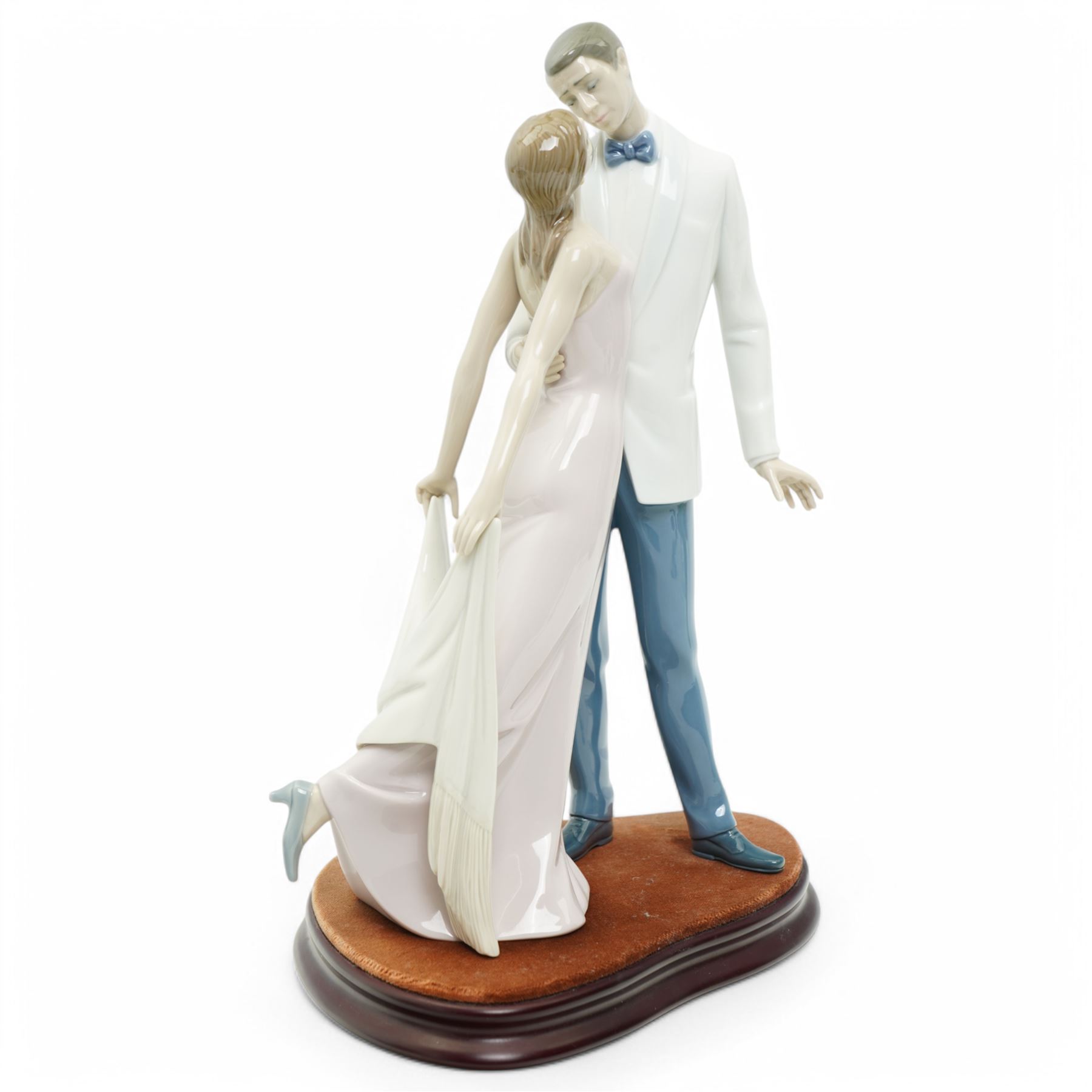 Two Lladro figures, comprising First Melodies 6475 and Happy Anniversary 8292, with one Nadal ballerina, all boxed, tallest H31cm excluding base (3)