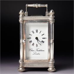 Chas Frodsham, London - A miniature carriage clock with white dial in engraved silver case...