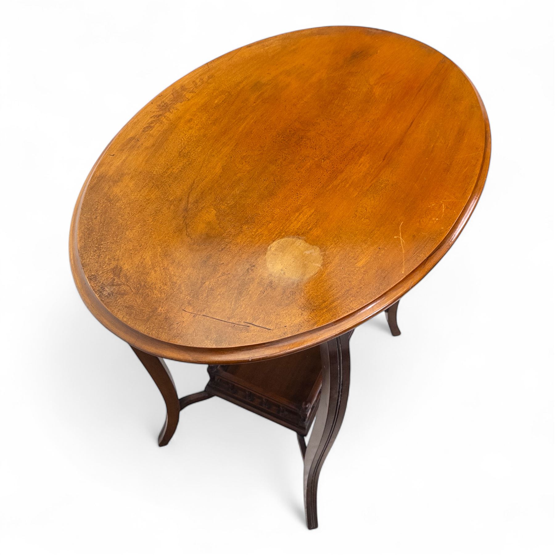 Set of two early 20th century mahogany occasional tables, comprising an oval example with under-tier and galleried shelf on swept supports, and a drop-leaf Sutherland table with turned gateleg supports and stretcher base (Oval H 74cm, W 57cm, D 86cm) (Sutherland H 71cm, W 30cm-94cm, D 76cm)