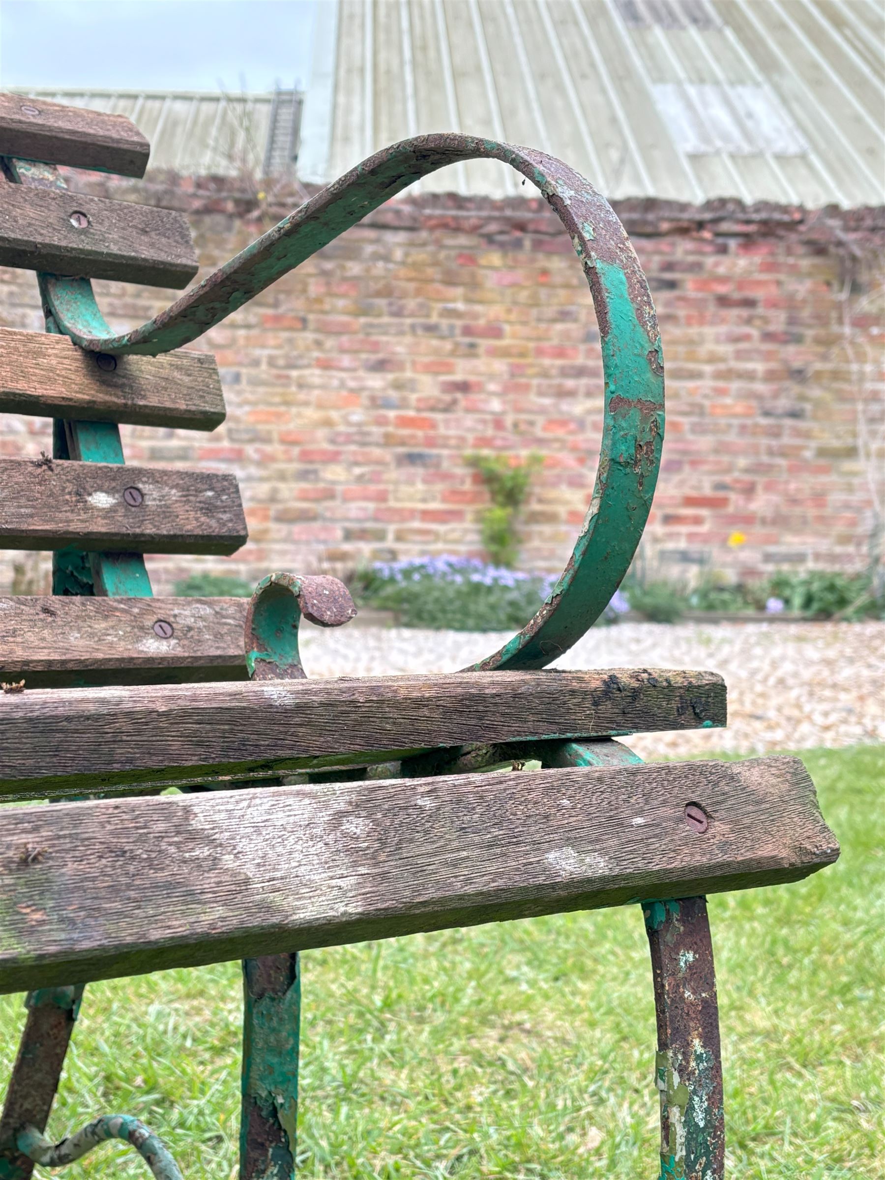 19th century scrolled wrought iron park bench with teak slatted seat and back. H76cm, L183cm, D65cm.  - COLLECTION BY APPOINTMENT FROM: The White House, Thirsk Road, Easingwold, York, YO61 3NF - CALL 01723 507111 TO ARRANGE