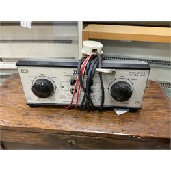 Six shelved cabinets for displaying ‘00’ gauge locomotives comprising plain plywood and white painted examples with track applied to various shelves, largest H63cm, W107cm, D27cm; Collection of tools for building model locomotives to include Weller PU-2D Soldering Pencil and Standard Tip Soldering Iron 20W/230V, Humbrol Modellers Airbrush, Power Supply Units and two wooden chests one of which housing a collection of tools including tweezers, scalping tools, wrenches etc 