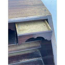 George III mahogany bureau, the conch inlaid fall front enclosing pigeon holes, shelves and central cupboard with inlaid flower motif, four graduating cock-beaded drawers below each with brass handles, lower moulded edge over shaped bracket feet