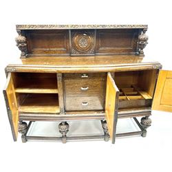 Mid 20th century carved oak West Riding sideboard, raised back, three shield panel doors on carved cup and cover supports joined by perimeter stretcher
