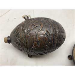 19th century bug bear flask carved with Balkan figures, a wolf and leafage with glass eyes, L14cm on stand 