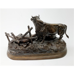 After Jules Moigniez (French 1835-1894), bronze figure group modelled as a bull, cow and calf on naturalistically modelled ground before a fence, upon an oval base, signed J Moigniez, L39cm