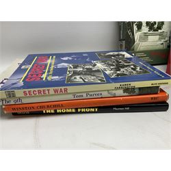 Thirty modern books of military interest including The Wartime Scrapbook 1939-1945; D-Day by Stephen Badsey; The D-Day Experience by Richard Holmes; Desert Rats by John Parker; A Most Secret Squadron by Des Curtis; Flying Colours - The Epic Story of Douglas Bader by Laddie Lucas etc; and quantity of DVDs of war and military interest